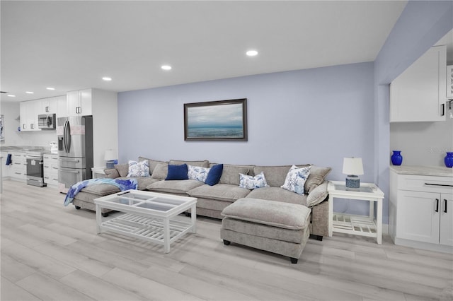 1701 Pinehurst Rd Unit 33E, Dunedin, FL 34698 - living area with light wood-style flooring and recessed lighting