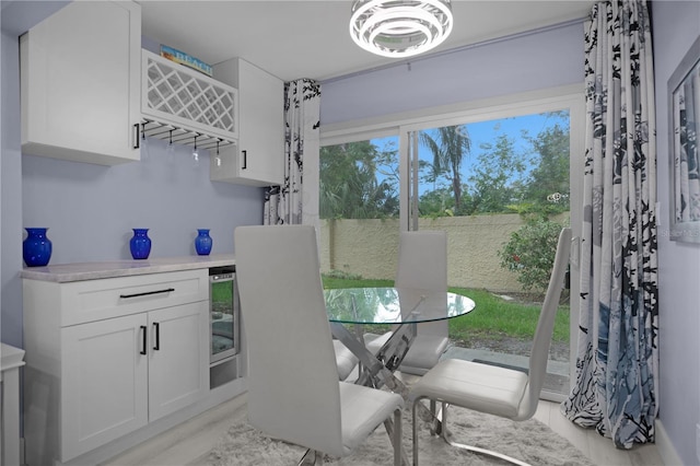 1701 Pinehurst Rd Unit 33E, Dunedin, FL 34698 - dining space featuring wine cooler and a bar