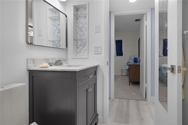 1701 Pinehurst Rd Unit 33E, Dunedin, FL 34698 - bathroom with vanity and wood finished floors