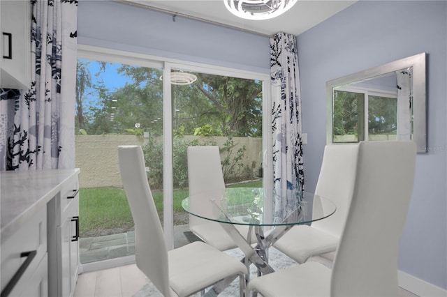 1701 Pinehurst Rd Unit 33E, Dunedin, FL 34698 - dining room with plenty of natural light and light tile patterned floors