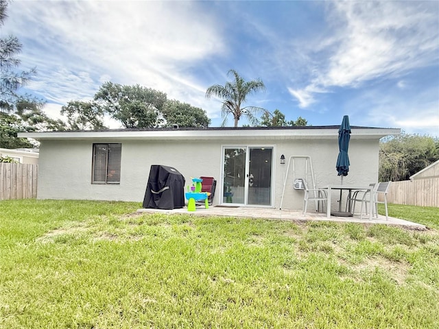 630 Timber Bay Cir W, Oldsmar, FL 34677 - back of house featuring stucco siding and a patio