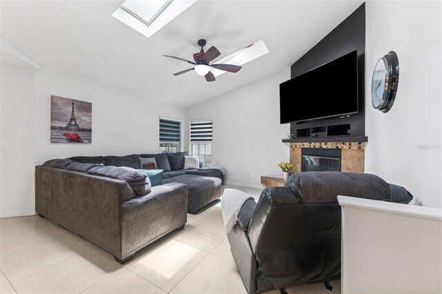 3509 Country Creek Ln, Valrico, FL 33596 - living room with a skylight, lofted ceiling, a ceiling fan, light tile patterned floors, and a glass covered fireplace