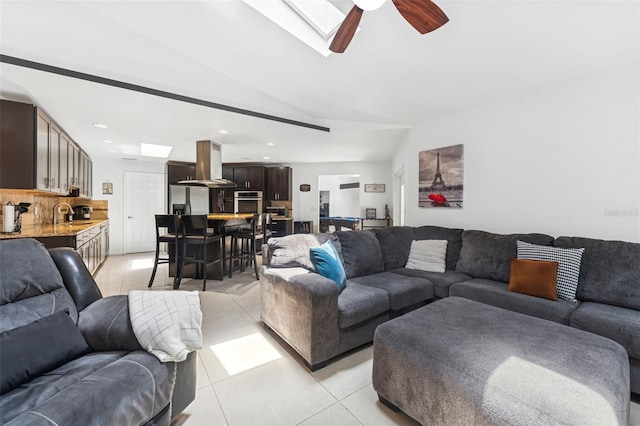 3509 Country Creek Ln, Valrico, FL 33596 - living area featuring light tile patterned floors, ceiling fan, a skylight, recessed lighting, and vaulted ceiling