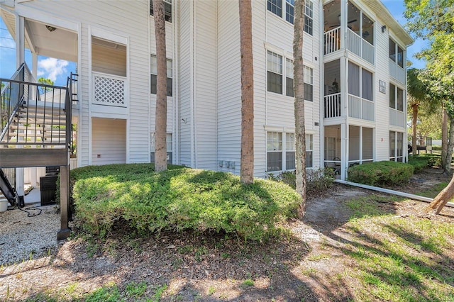 3301 Haviland Ct Unit 301, Palm Harbor, FL 34684 - view of building exterior featuring stairs