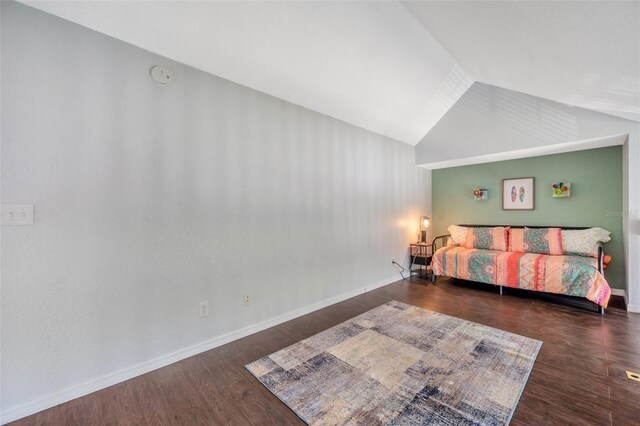 3301 Haviland Ct Unit 301, Palm Harbor, FL 34684 - bedroom with vaulted ceiling and wood finished floors