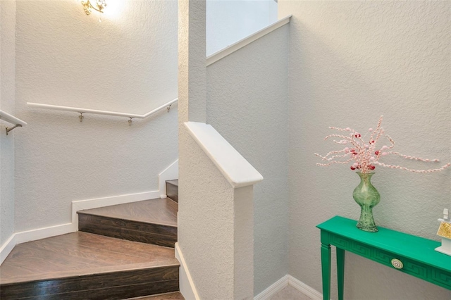 3301 Haviland Ct Unit 301, Palm Harbor, FL 34684 - staircase with wood finished floors and baseboards