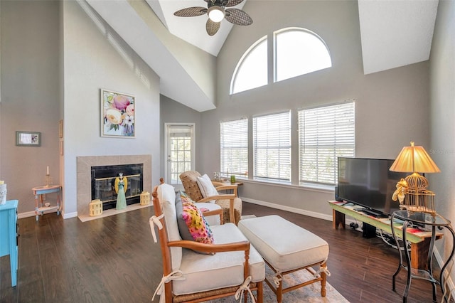 3301 Haviland Ct Unit 301, Palm Harbor, FL 34684 - living area featuring a ceiling fan, a fireplace, high vaulted ceiling, and wood finished floors