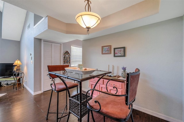 3301 Haviland Ct Unit 301, Palm Harbor, FL 34684 - dining area featuring baseboards and dark wood-style flooring