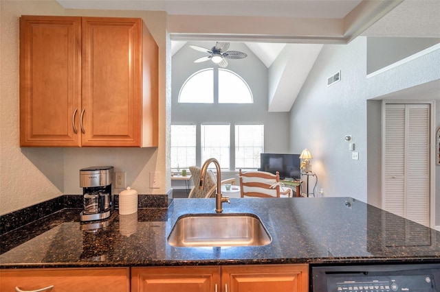 3301 Haviland Ct Unit 301, Palm Harbor, FL 34684 - kitchen with ceiling fan, dishwasher, dark stone countertops, and high vaulted ceiling
