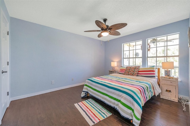 3301 Haviland Ct Unit 301, Palm Harbor, FL 34684 - bedroom with wood finished floors, a textured ceiling, and ceiling fan
