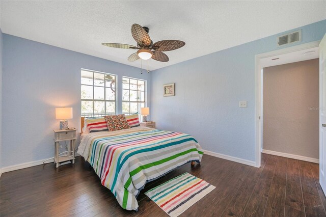 3301 Haviland Ct Unit 301, Palm Harbor, FL 34684 - bedroom featuring wood-type flooring, a ceiling fan, and a textured ceiling