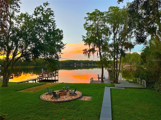 20111 County Line Rd, Lutz, FL 33558 - view of home's community with a water view, a fire pit, a dock, and a lawn