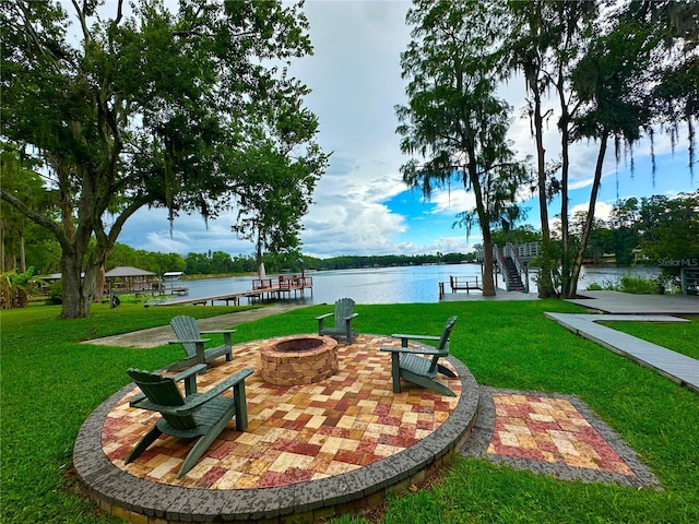 20111 County Line Rd, Lutz, FL 33558 - view of property's community with an outdoor fire pit, a lawn, a water view, and a boat dock
