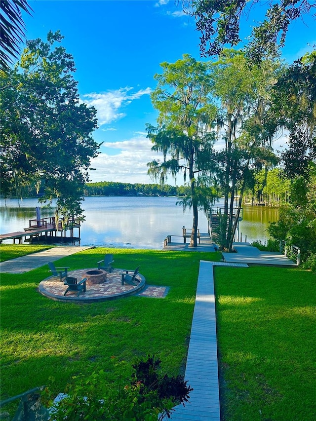 20111 County Line Rd, Lutz, FL 33558 - view of grassy yard featuring a water view and an outdoor fire pit
