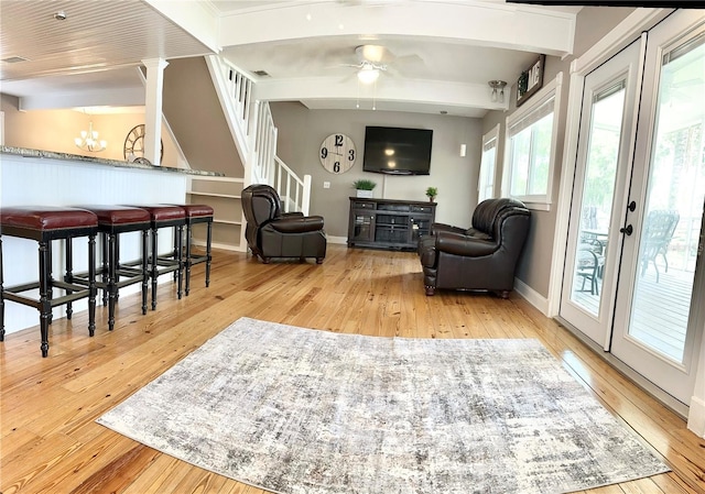 20111 County Line Rd, Lutz, FL 33558 - living room with a chandelier, hardwood / wood-style flooring, stairway, ceiling fan, and beam ceiling