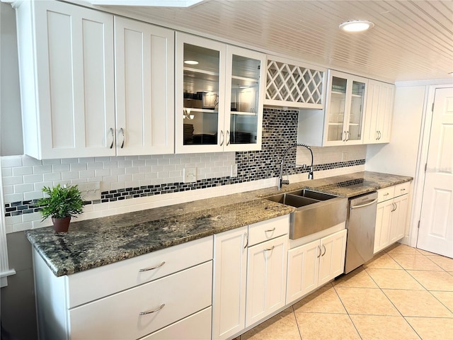 20111 County Line Rd, Lutz, FL 33558 - kitchen with dishwasher, decorative backsplash, light tile patterned flooring, and glass insert cabinets