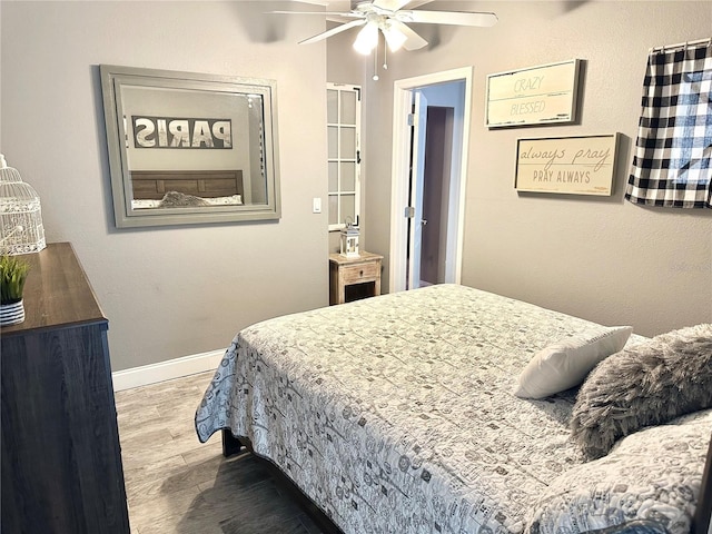 20111 County Line Rd, Lutz, FL 33558 - bedroom featuring wood finished floors and a ceiling fan
