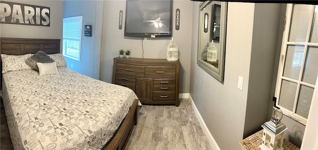 20111 County Line Rd, Lutz, FL 33558 - bedroom with light wood finished floors and baseboards