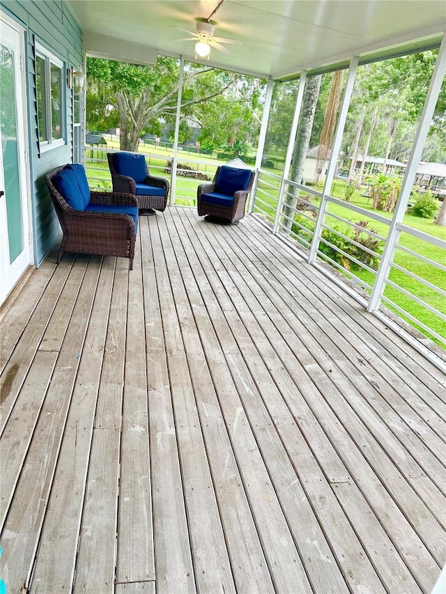20111 County Line Rd, Lutz, FL 33558 - wooden porch with ceiling fan and a yard