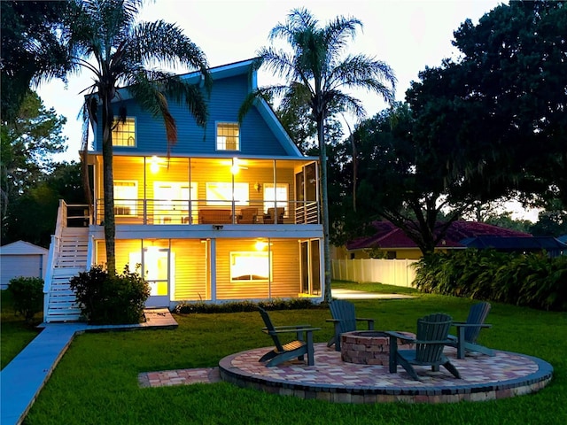 20111 County Line Rd, Lutz, FL 33558 - rear view of house with stairway, a fire pit, a patio area, and a balcony