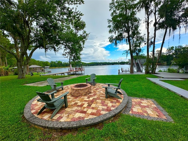 20111 County Line Rd, Lutz, FL 33558 - view of green lawn with an outdoor fire pit and a water view