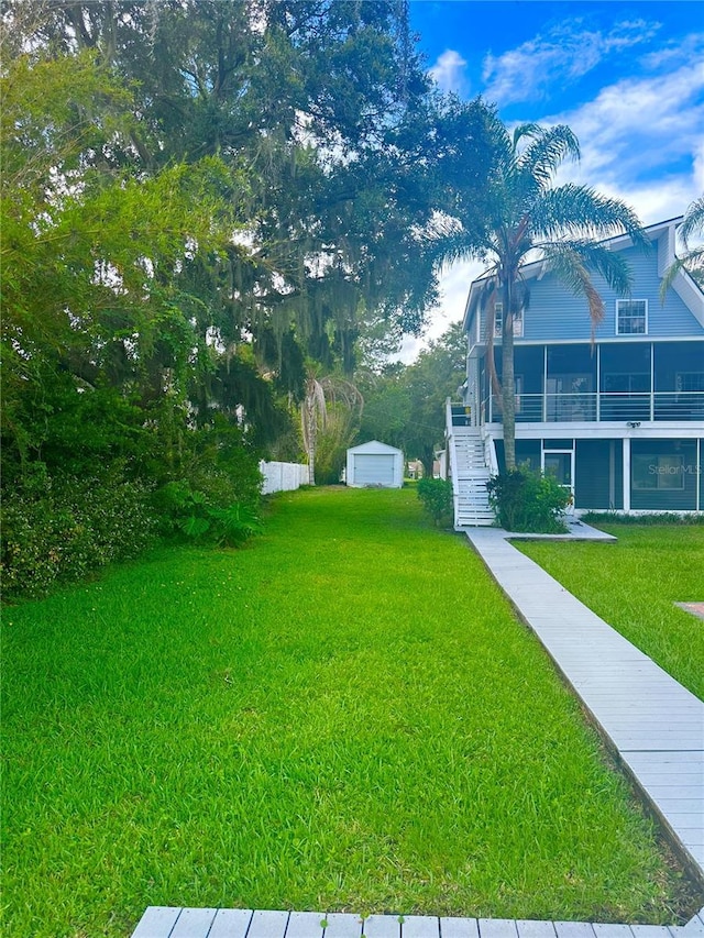 20111 County Line Rd, Lutz, FL 33558 - view of green lawn with stairs and an outdoor structure