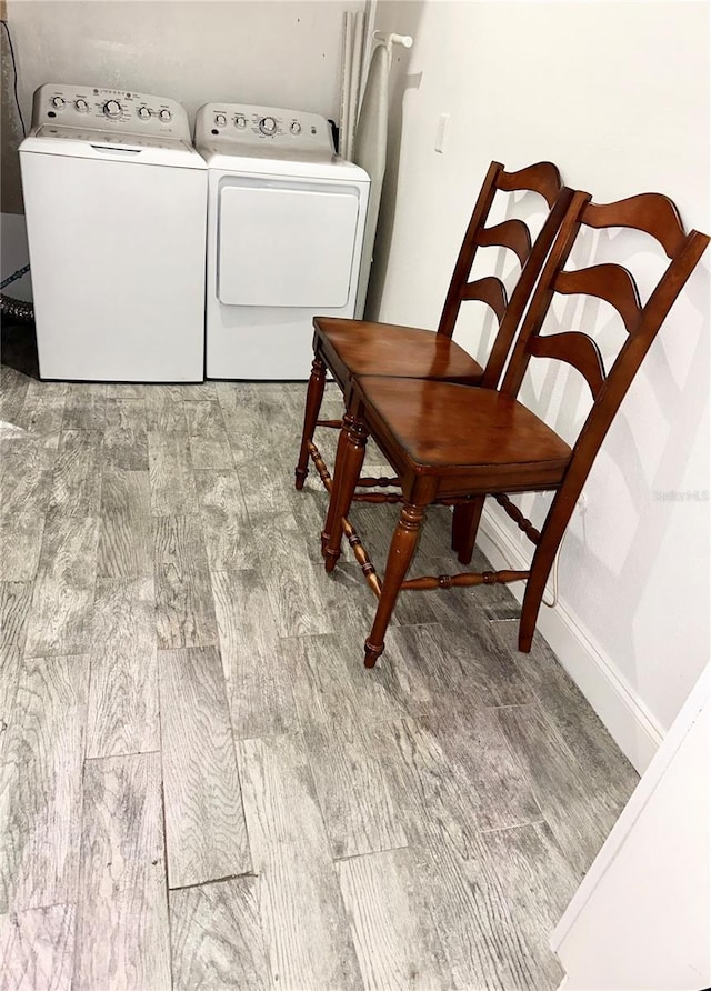 20111 County Line Rd, Lutz, FL 33558 - washroom with wood finished floors and washer and dryer