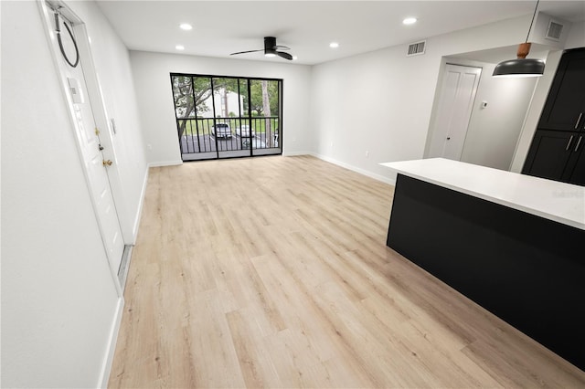 3232 Lake Pine Way E Unit A2, Tarpon Springs, FL 34688 - unfurnished living room with ceiling fan, light wood finished floors, and recessed lighting