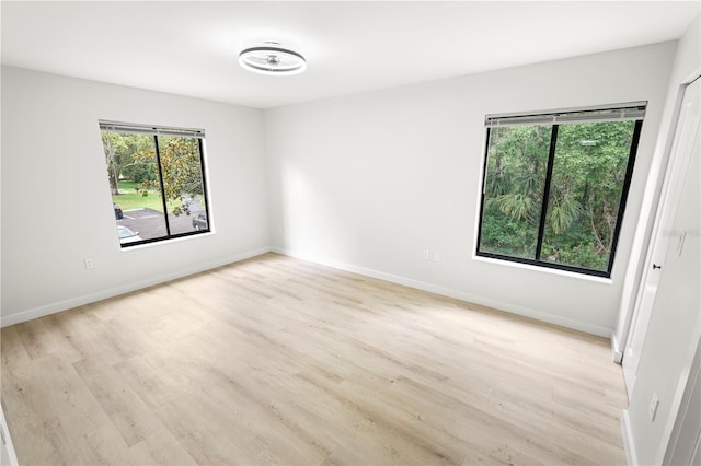 3232 Lake Pine Way E Unit A2, Tarpon Springs, FL 34688 - unfurnished room with light wood finished floors