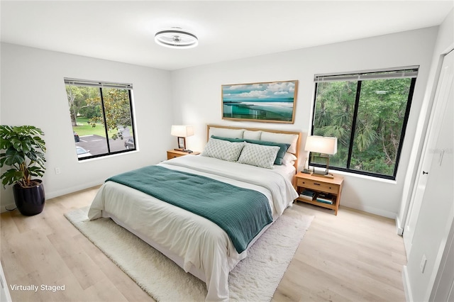 3232 Lake Pine Way E Unit A2, Tarpon Springs, FL 34688 - bedroom featuring light wood-style floors