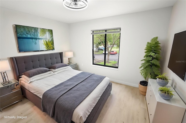 3232 Lake Pine Way E Unit A2, Tarpon Springs, FL 34688 - bedroom with light wood finished floors and baseboards