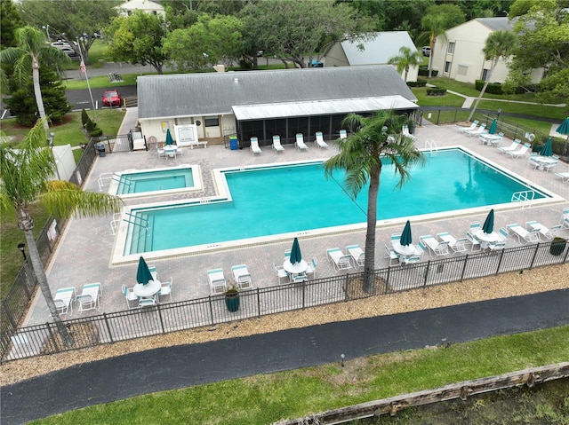3232 Lake Pine Way E Unit A2, Tarpon Springs, FL 34688 - community pool featuring a patio