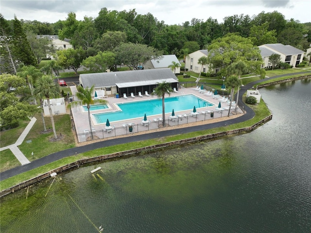 3232 Lake Pine Way E Unit A2, Tarpon Springs, FL 34688 - drone / aerial view of a pool area and a nearby body of water
