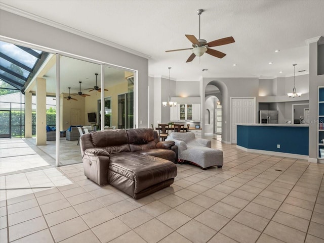6905 Arabian Rd, Odessa, FL 33556 - living area featuring a chandelier, a ceiling fan, light tile patterned floors, crown molding, and arched walkways