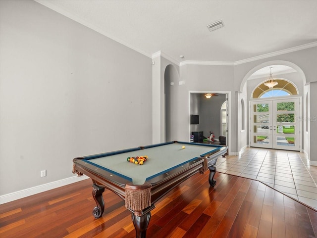 6905 Arabian Rd, Odessa, FL 33556 - playroom with arched walkways, french doors, wood finished floors, crown molding, and billiards