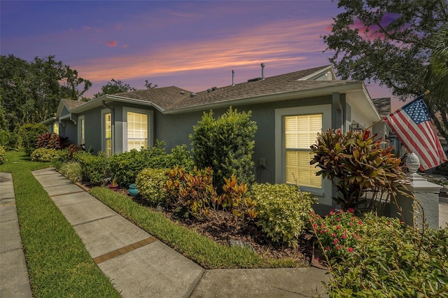6041 Sandhill Ridge Dr, Lithia, FL 33547 - view of front facade with stucco siding and a shingled roof