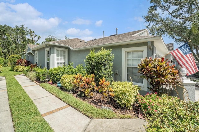 6041 Sandhill Ridge Dr, Lithia, FL 33547 - view of front of home with stucco siding and roof with shingles