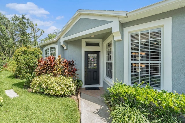 6041 Sandhill Ridge Dr, Lithia, FL 33547 - doorway to property with stucco siding