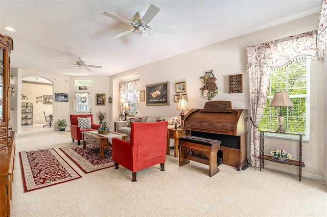 6041 Sandhill Ridge Dr, Lithia, FL 33547 - carpeted living area with a ceiling fan, plenty of natural light, and arched walkways