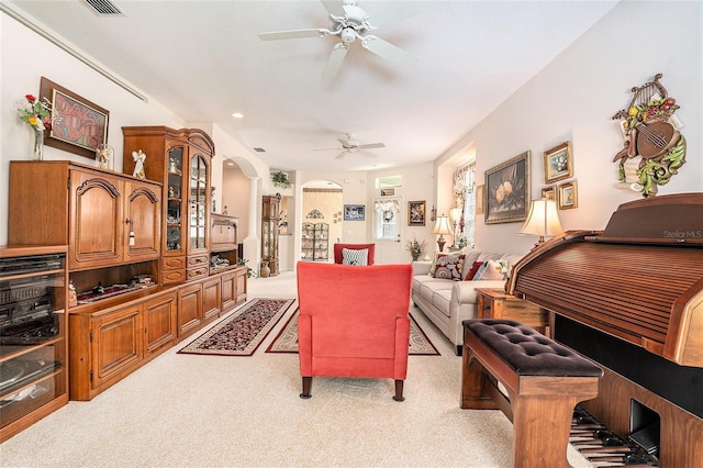 6041 Sandhill Ridge Dr, Lithia, FL 33547 - living room with a ceiling fan, arched walkways, and light carpet