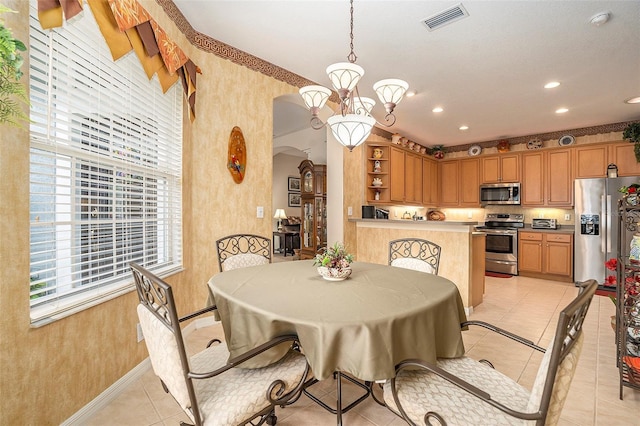 6041 Sandhill Ridge Dr, Lithia, FL 33547 - dining room featuring arched walkways, a chandelier, light tile patterned floors, wallpapered walls, and recessed lighting