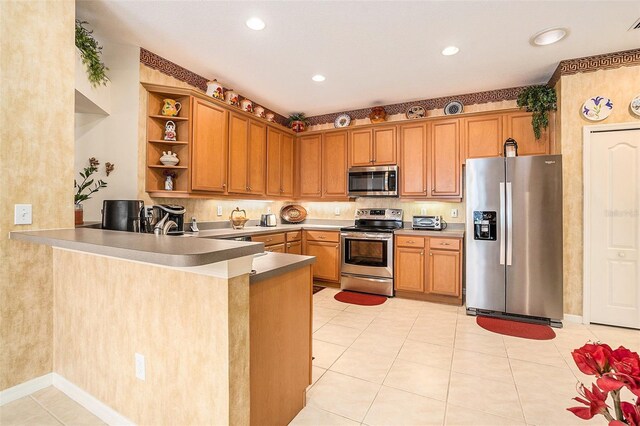 6041 Sandhill Ridge Dr, Lithia, FL 33547 - kitchen with appliances with stainless steel finishes, open shelves, a peninsula, light tile patterned floors, and brown cabinets