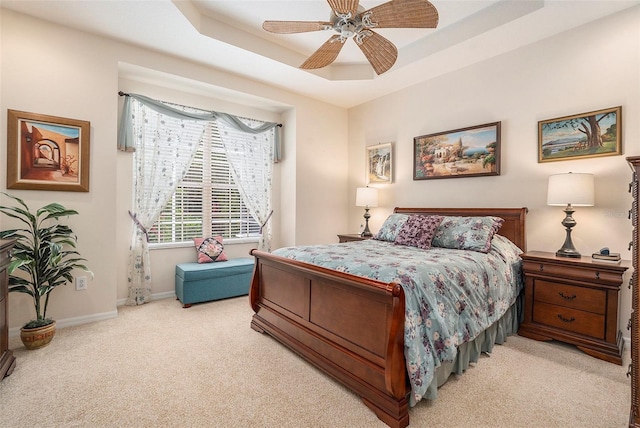 6041 Sandhill Ridge Dr, Lithia, FL 33547 - bedroom with light colored carpet, a ceiling fan, and a tray ceiling