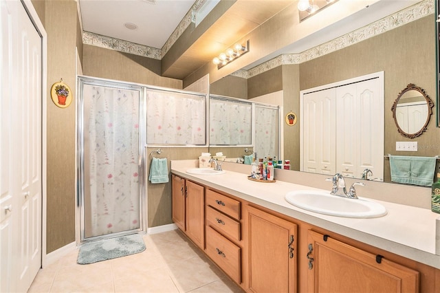 6041 Sandhill Ridge Dr, Lithia, FL 33547 - bathroom featuring double vanity, a shower stall, and tile patterned floors
