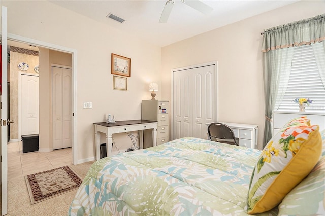 6041 Sandhill Ridge Dr, Lithia, FL 33547 - carpeted bedroom with a closet, tile patterned flooring, and a ceiling fan