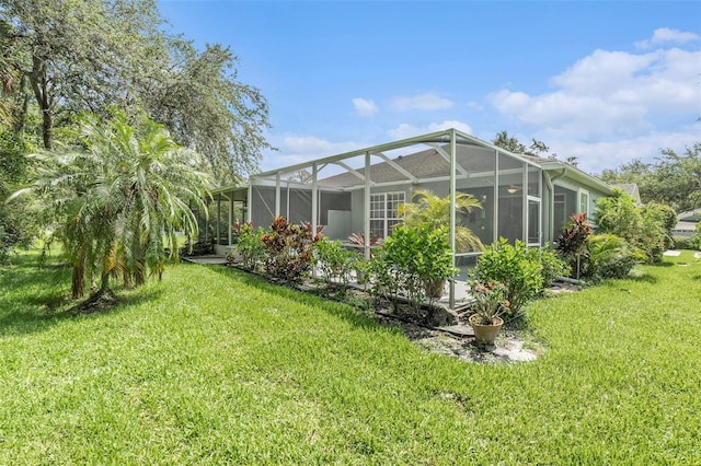 6041 Sandhill Ridge Dr, Lithia, FL 33547 - back of house featuring a yard and glass enclosure