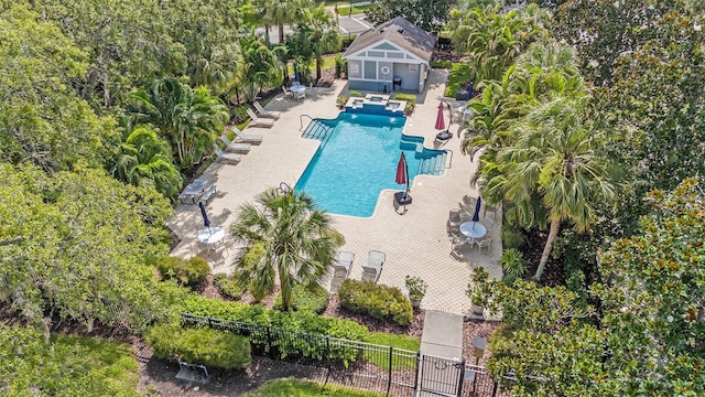6041 Sandhill Ridge Dr, Lithia, FL 33547 - community pool featuring a patio and view of wooded area