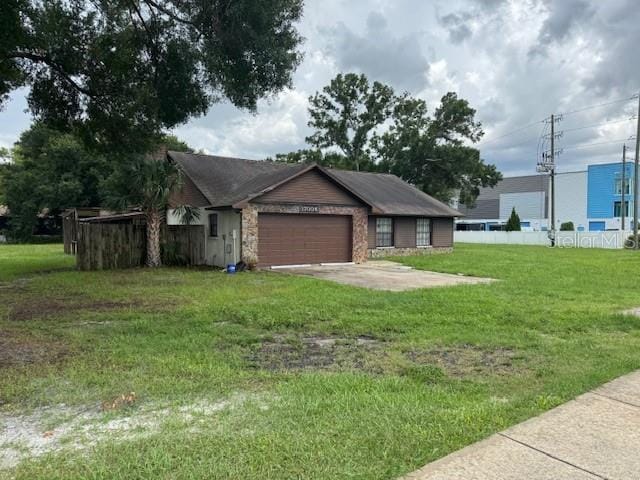 17004 State Road 54, Lutz, FL 33558 - view of front facade with a garage and a front lawn