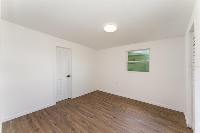 833 N Suwannee Ave, Lakeland, FL 33815 - empty room with wood finished floors