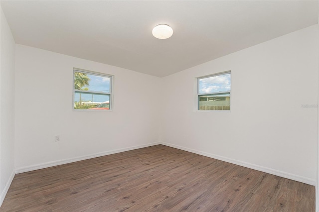 833 N Suwannee Ave, Lakeland, FL 33815 - unfurnished room with wood finished floors and baseboards